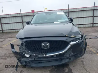 2020 Mazda CX-5 Grand Touring with VIN JM3KFADM8L0811910, listed as a IAAI auction lot 41446214 with 57,849 mi miles. Bid and sale history available at carsss.com. Image 13.