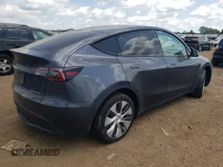 2022 Tesla Model Y Long Range with VIN 7SAYGDEE3NA007737, listed as a Copart auction lot 64602984 with 42,597 mi miles and Salvage Title. Bid and sale history available at carsss.com. Image 3.