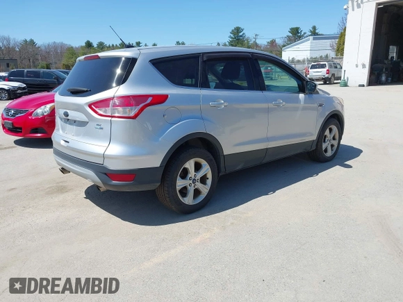 2015 Ford Escape SE with VIN 1FMCU9GX0FUB99881, listed as a IAAI auction lot 42114415 with 138,561 mi miles. Bid and sale history available at carsss.com. Image 4.