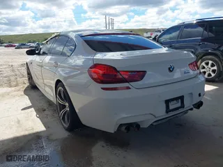 2014 BMW M6 with VIN WBS6C9C50EDV73809, listed as a IAAI auction lot 41648991 with 68,054 mi miles. Bid and sale history available at carsss.com. Image 3.