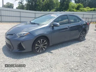 2019 Toyota Corolla L z VIN 5YFBURHE4KP869548, wystawiony jako Copart lot #59943055 z przebiegiem 155 099 mil mil oraz Czysty tytuł • Clean title. Historia ofert i sprzedaży dostępna na DreamBid. Obrazek 1.