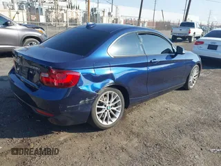 2015 BMW 2 Series 228i xDrive with VIN WBA1F7C5XFV367287, listed as a IAAI auction lot 40802463 with 113,427 mi miles and . Bid and sale history available at carsss.com. Image 4.
