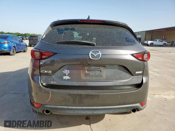 2019 Mazda CX-5 Grand Touring with VIN JM3KFADM8K1634011, listed as a Copart auction lot 57343455 with 67,138 mi miles and Salvage title. Bid and sale history available at DreamBid. Image 6.