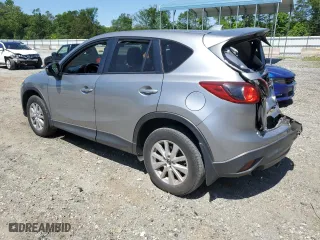 2014 Mazda CX-5 Touring with VIN JM3KE4CY9E0415402, listed as a Copart auction lot 56576114 with 181,719 mi miles and Salvage Title. Bid and sale history available at carsss.com. Image 2.