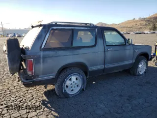1986 Chevrolet Blazer z VIN 1G8CT18RXG8180574, wystawiony jako Copart lot #87987925 z przebiegiem 82 571 mil mil oraz Szkoda całkowita • Salvage title. Historia ofert i sprzedaży dostępna na DreamBid. Obrazek 3.