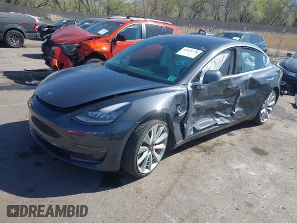 2018 Tesla Model 3 Long Range Battery with VIN 5YJ3E1EBXJF055203, listed as a IAAI auction lot 42019770 with 57,379 mi miles and . Bid and sale history available at DreamBid. Image 17.