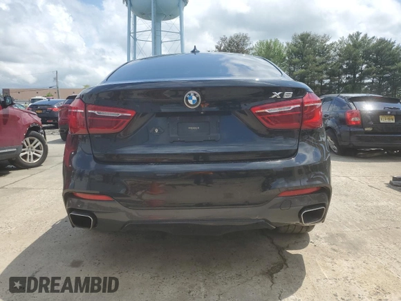 2015 BMW X6 xDrive35i z VIN 5UXKU2C58F0N77513, wystawiony jako Copart lot #55859345 z przebiegiem 82 560 mil mil oraz Szkoda całkowita • Salvage title. Historia ofert i sprzedaży dostępna na DreamBid. Obrazek 6.