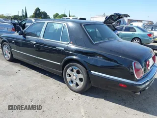 2001 Bentley Arnage with VIN SCBLC31E11CX06297, listed as a IAAI auction lot 41980275 with 63,510 mi miles and . Bid and sale history available at DreamBid. Image 3.