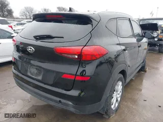 2021 Hyundai Tucson Value with VIN KM8J33A44MU309432, listed as a IAAI auction lot 41653676 with 67,036 mi miles. Bid and sale history available at carsss.com. Image 4.