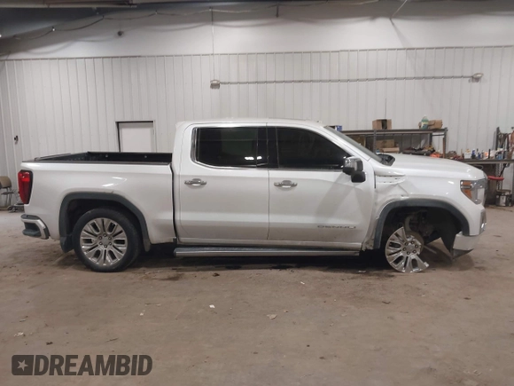 2020 GMC Sierra 1500 Denali z VIN 1GTU9FEL9LZ116486, wystawiony jako IAAI lot #41392384 z przebiegiem 61 283 mil mil oraz . Historia ofert i sprzedaży dostępna na DreamBid. Obrazek 13.