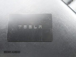 2019 Tesla Model 3 Mid Range with VIN 5YJ3E1EA2KF395549, listed as a IAAI auction lot 41895977 with 97,108 mi miles and . Bid and sale history available at carsss.com. Image 11.