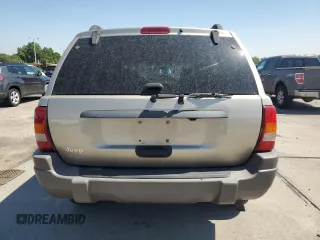 2003 Jeep Grand Cherokee Laredo with VIN 1J4GW48S23C524693, listed as a Copart auction lot 64461755 with 243,936 mi miles and Salvage title. Bid and sale history available at DreamBid. Image 6.