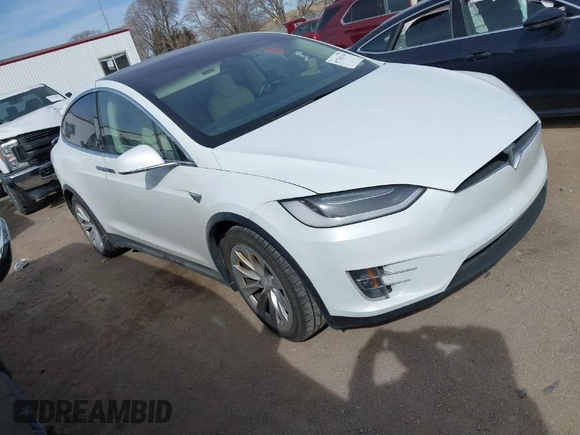 2018 Tesla Model X 75D with VIN 5YJXCBE27JF121834, listed as a IAAI auction lot 41769246 with 90,814 mi miles and . Bid and sale history available at carsss.com. Image 1.