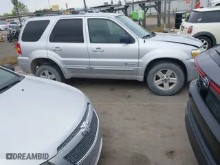 2005 Ford Escape Hybrid with VIN 1FMCU95H05KC95225, listed as a IAAI auction lot 41798610 with 216,659 mi miles. Bid and sale history available at carsss.com. Image 13.
