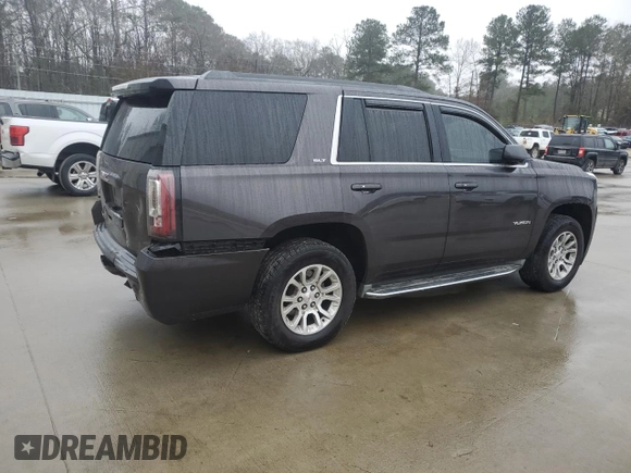 2015 GMC Yukon SLT with VIN 1GKS1BKC9FR278056, listed as a Copart auction lot 44989505 with 205,885 mi miles and Salvage Title. Bid and sale history available at carsss.com. Image 3.