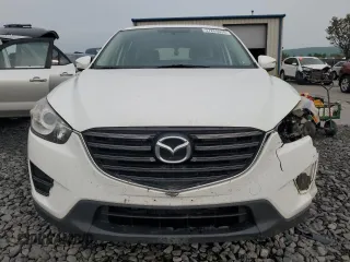 2016 Mazda CX-5 Sport с VIN JM3KE4BY4G0899953, выставлен на аукционе Copart как лот 57269035 с пробегом 196 158 миль миль и Списание • Salvage title. История ставок и продаж доступна на DreamBid. Изображение 5.