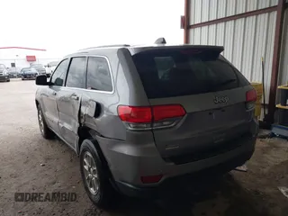 2018 Jeep Grand Cherokee Laredo E with VIN 1C4RJEAG1JC275356, listed as a IAAI auction lot 42150422 with 69,720 mi miles and . Bid and sale history available at DreamBid. Image 3.