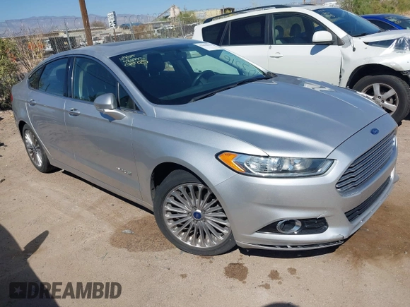 2014 Ford Fusion Titanium Hybrid with VIN 3FA6P0RUXER103516, listed as a IAAI auction lot 42004602 with 128,287 mi miles and . Bid and sale history available at carsss.com. Image 1.