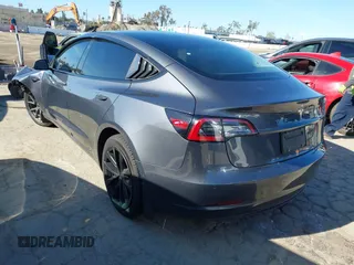 2022 Tesla Model 3 with VIN 5YJ3E1EA3NF165054, listed as a IAAI auction lot 41805729 with 225,773 mi miles. Bid and sale history available at carsss.com. Image 3.