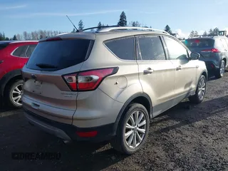2017 Ford Escape Titanium with VIN 1FMCU0JD0HUB79739, listed as a IAAI auction lot 41807975 with 121,902 mi miles. Bid and sale history available at carsss.com. Image 4.