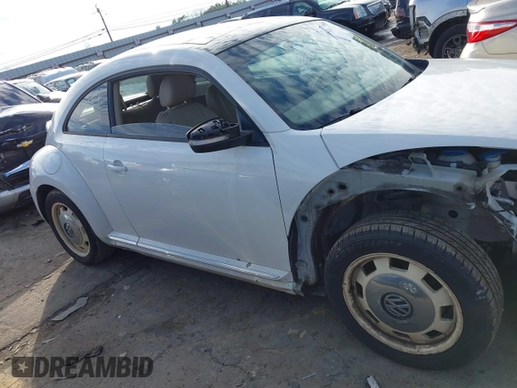 2014 Volkswagen Beetle 2.5L w/Sun with VIN 3VWJP7ATXEM628666, listed as a IAAI auction lot 41328014 with 70,990 mi miles and . Bid and sale history available at DreamBid. Image 14.