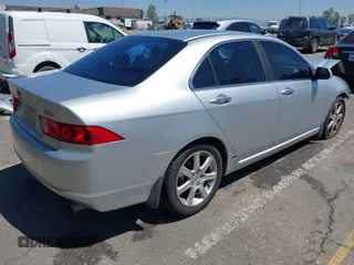 2004 Acura TSX w/Navigation z VIN JH4CL96934C023631, wystawiony jako IAAI lot #41993059 z przebiegiem 165 449 mil mil oraz . Historia ofert i sprzedaży dostępna na DreamBid. Obrazek 4.