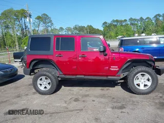 2011 Jeep Wrangler Unlimited Sport with VIN 1J4BA3H18BL598323, listed as a IAAI auction lot 41958043 with 154,354 mi miles. Bid and sale history available at carsss.com. Image 13.