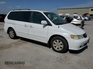 2004 Honda Odyssey EX-L with VIN 5FNRL18974B092979, listed as a Copart auction lot 52429055 with 106,515 mi miles and Clean Title. Bid and sale history available at DreamBid. Image 4.