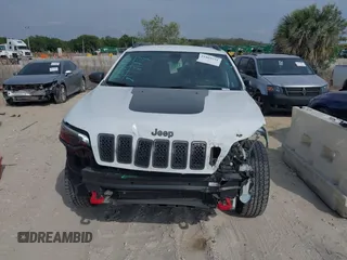 2019 Jeep Cherokee Trailhawk Elite with VIN 1C4PJMBN3KD487461, listed as a IAAI auction lot 41869751 with 91,197 mi miles and . Bid and sale history available at DreamBid. Image 13.