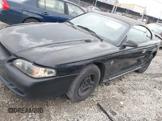 1997 Ford Mustang with VIN 1FALP4041VF129619, listed as a IAAI auction lot 41440766 with 135,934 mi miles. Bid and sale history available at carsss.com. Image 2.