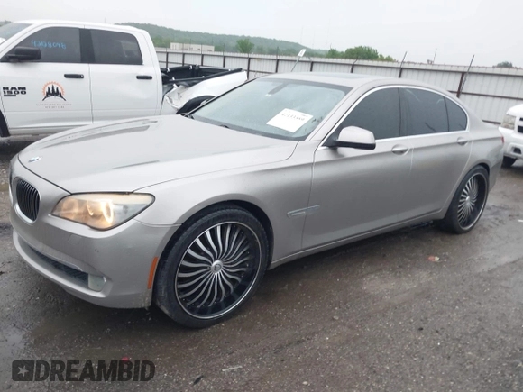 2012 BMW 7 Series 750i with VIN WBAKA8C50CDX01319, listed as a IAAI auction lot 42133359 with 168,986 mi miles and . Bid and sale history available at DreamBid. Image 2.