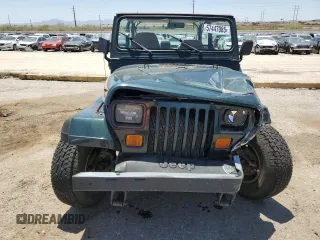 1994 Jeep Wrangler S with VIN 1J4FY19P7RP437520, listed as a Copart auction lot 57447085 with 124,023 mi miles and Salvage title. Bid and sale history available at DreamBid. Image 5.