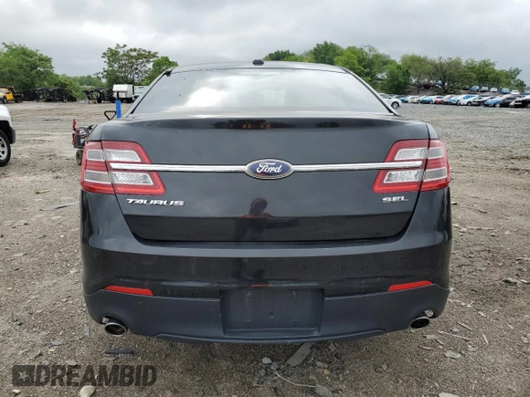 2014 Ford Taurus SEL z VIN 1FAHP2E85EG184686, wystawiony jako Copart lot #55862775 z przebiegiem 238 217 mil mil oraz Czysty tytuł • Clean title. Historia ofert i sprzedaży dostępna na DreamBid. Obrazek 6.