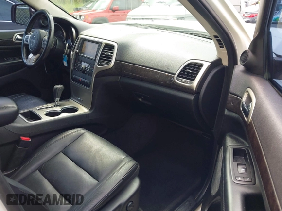 2011 Jeep Grand Cherokee Laredo with VIN 1J4RR4GG7BC701007, listed as a IAAI auction lot 42704995 with 145,956 mi miles and . Bid and sale history available at DreamBid. Image 5.
