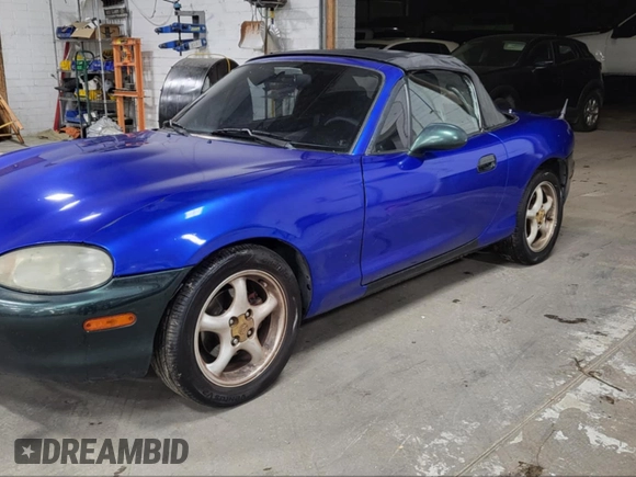 1999 Mazda MX-5 Miata z VIN JM1NB3536X0121095, wystawiony jako IAAI lot #42138447 z przebiegiem 146 636 mil mil oraz . Historia ofert i sprzedaży dostępna na DreamBid. Obrazek 2.