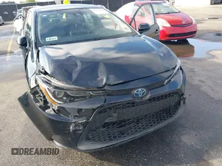 2021 Toyota Corolla Hybrid LE with VIN JTDEAMDE3MJ025426, listed as a IAAI auction lot 41922582 with 57,705 mi miles. Bid and sale history available at carsss.com. Image 6.