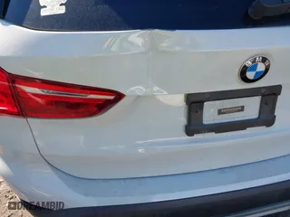2017 BMW X1 xDrive28i with VIN WBXHT3C37H5F69725, listed as a IAAI auction lot 41588095 with 109,704 mi miles. Bid and sale history available at carsss.com. Image 6.