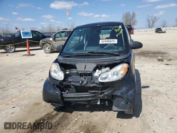 2009 Smart fortwo Pure z VIN WMEEJ31X49K219479, wystawiony jako Copart lot #52446625 z przebiegiem 82 337 mil mil oraz Szkody całkowita. Historia ofert i sprzedaży dostępna na DreamBid. Obrazek 5.