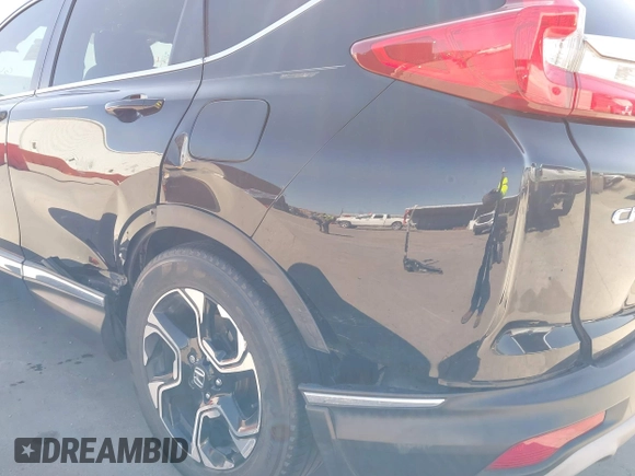 2018 Honda CR-V Touring with VIN 2HKRW2H91JH630702, listed as a IAAI auction lot 41983516 with 84,355 mi miles. Bid and sale history available at carsss.com. Image 6.