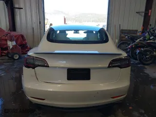 2022 Tesla Model 3 Performance with VIN 5YJ3E1EC7NF202933, listed as a IAAI auction lot 41527229 with 59,315 mi miles. Bid and sale history available at carsss.com. Image 17.