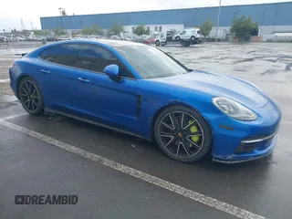 2018 Porsche Panamera 4 E-Hybrid z VIN WP0AE2A77JL127924, wystawiony jako IAAI lot #41778023 z przebiegiem 81 800 mil mil oraz . Historia ofert i sprzedaży dostępna na DreamBid. Obrazek 1.