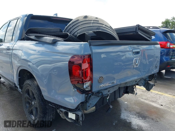 2023 Honda Ridgeline Black Edition z VIN 5FPYK3F83PB022931, wystawiony jako IAAI lot #42105410 z przebiegiem 42 807 mil mil oraz . Historia ofert i sprzedaży dostępna na DreamBid. Obrazek 18.