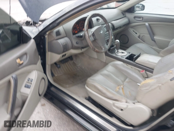 2003 Infiniti G35 w/Leather z VIN JNKCV54E13M215206, wystawiony jako IAAI lot #42466931 z przebiegiem 183 757 mil mil oraz . Historia ofert i sprzedaży dostępna na DreamBid. Obrazek 12.