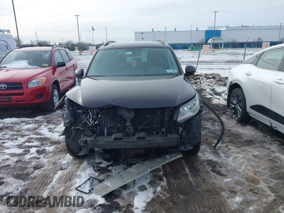 2017 Volkswagen Tiguan S with VIN WVGBV7AX7HK047973, listed as a IAAI auction lot 41197329 with 92,960 mi miles and . Bid and sale history available at DreamBid. Image 12.