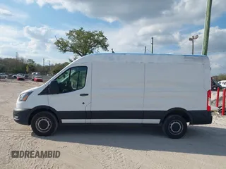 2021 Ford Transit Cargo with VIN 1FTBR1C85MKA19997, listed as a IAAI auction lot 41431285 with 61,158 mi miles and . Bid and sale history available at DreamBid. Image 14.