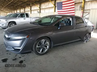 2018 Honda Clarity Touring z VIN JHMZC5F30JC021233, wystawiony jako Copart lot #61501225 z przebiegiem 95 075 mil mil oraz Szkoda całkowita • Salvage title. Historia ofert i sprzedaży dostępna na DreamBid. Obrazek 1.