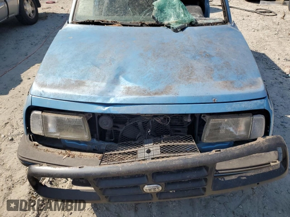 1995 Geo Tracker z VIN 2CNBE18UXS6930601, wystawiony jako Copart lot #76079094 z przebiegiem 276 136 mil mil oraz Szkody całkowita. Historia ofert i sprzedaży dostępna na DreamBid. Obrazek 11.