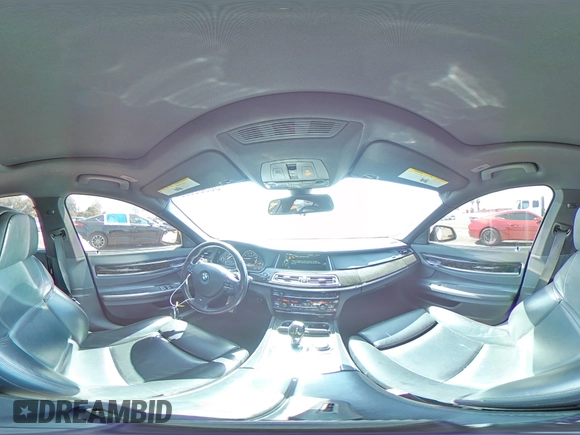 2013 BMW 7 Series 750i with VIN WBAYA8C54DC996412, listed as a Copart auction lot 56982895 with 124,258 mi miles and Salvage title. Bid and sale history available at DreamBid. Image 14.
