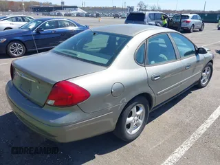 2002 Ford Taurus SE Standard with VIN 1FAFP53U02A215964, listed as a IAAI auction lot 42063534 with 187,424 mi miles and . Bid and sale history available at DreamBid. Image 4.
