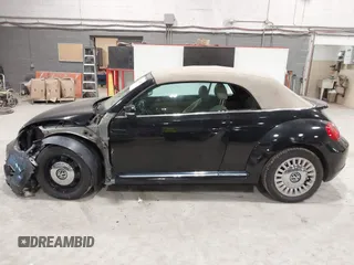 2014 Volkswagen Beetle 1.8T с VIN 3VW517AT5EM818796, выставлен на аукционе IAAI как лот 42318653 с пробегом 150 443 миль миль и . История ставок и продаж доступна на DreamBid. Изображение 14.